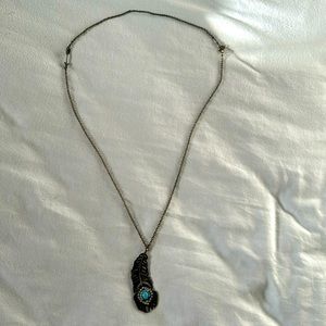 Clair’s feather necklace